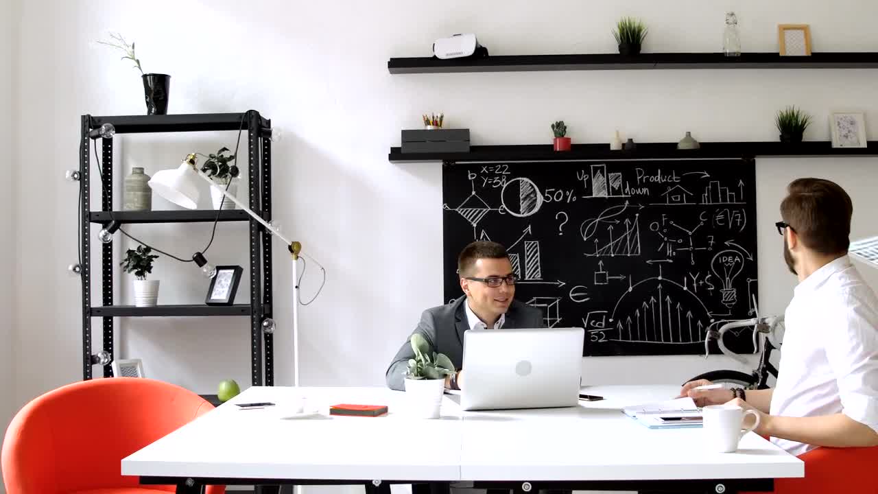   Stock Footage Web Design Team Look At Prototype In Modern Office Live Wallpaper