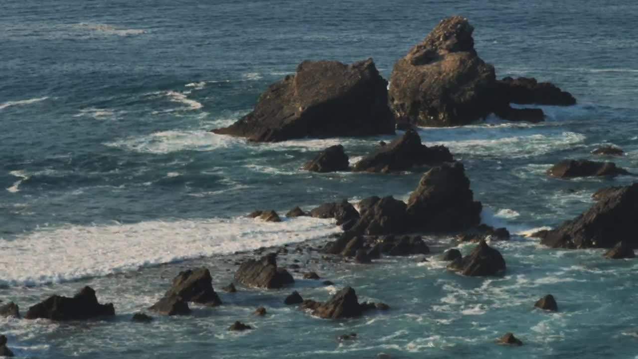   Stock Footage Waves Hitting Rocks On The Beach Live Wallpaper