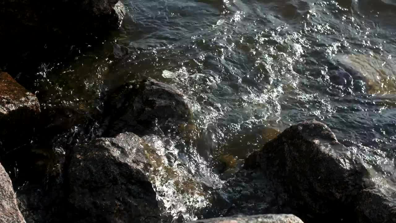   Stock Footage Waves Breaking Over Harbor Rocks Live Wallpaper