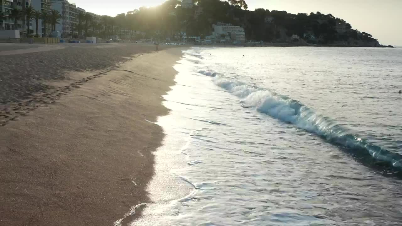   Stock Footage Waves Breaking By A Coastal Town Live Wallpaper