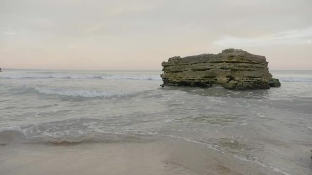   Stock Footage Waves Breaking Against A Large Rock Smalllive Wallpaper