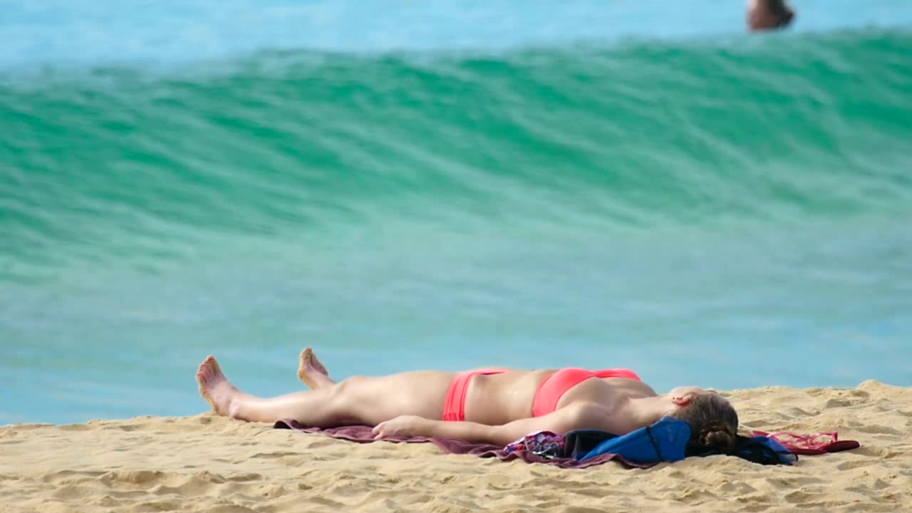   Stock Footage Wave Crashing In The Beach With A Girl In Bikini Live Wallpaper