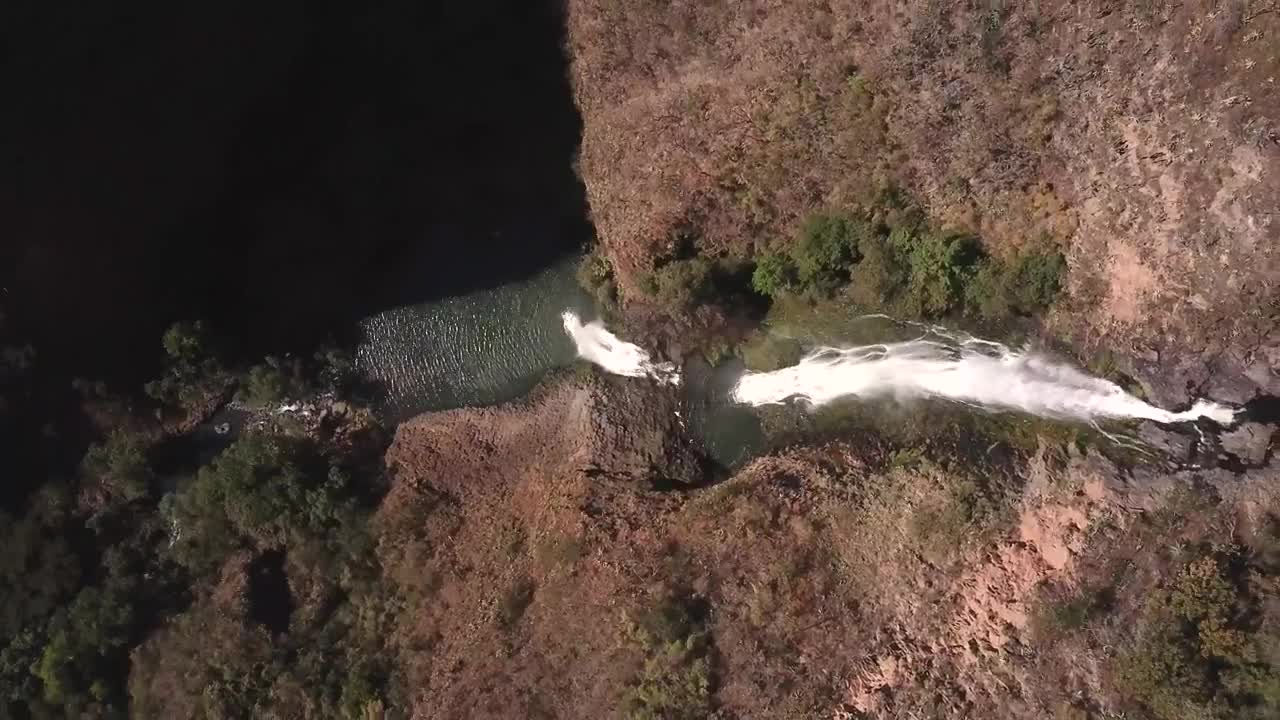   Stock Footage Waterfall Between Red Rocks And Trees Live Wallpaper