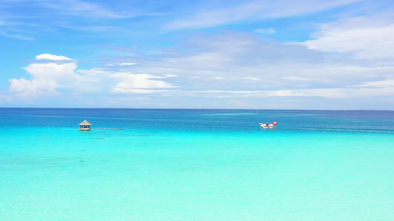   Stock Footage Water Plane Floating In The Turquoise Sea Live Wallpaper