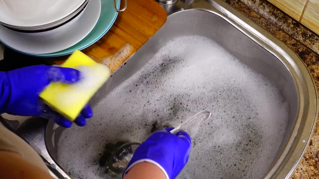   Stock Footage Washing Cutlery In A Sink Live Wallpaper
