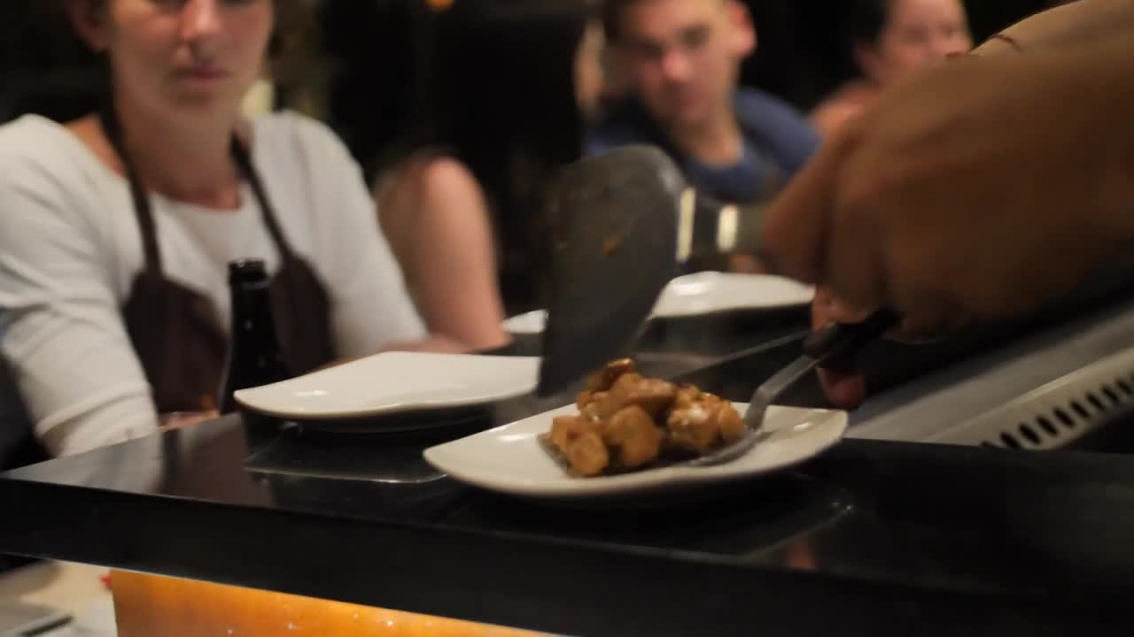   Stock Footage Waiter Serving Meat Stew In A Restaurant Live Wallpaper