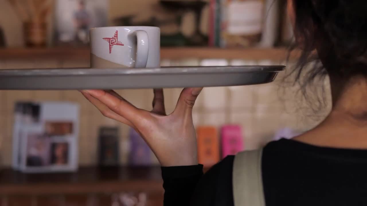   Stock Footage Waiter Carries A Cup Of Coffee To Customer Live Wallpaper