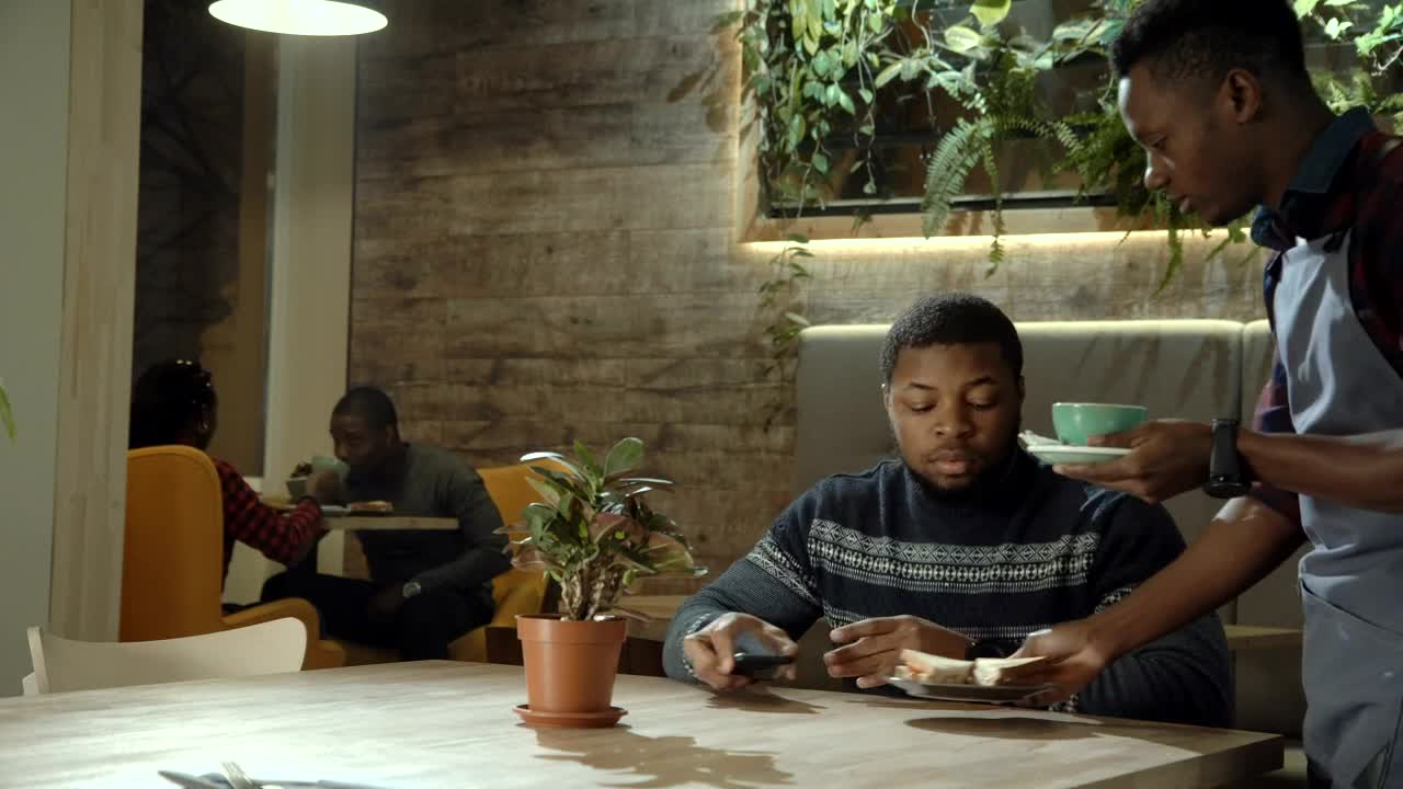   Stock Footage Waiter Bringing The Tea To The Customer Live Wallpaper