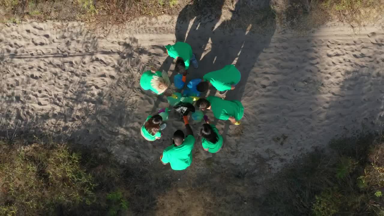   Stock Footage Volunteer Team Waving At A Drone Live Wallpaper