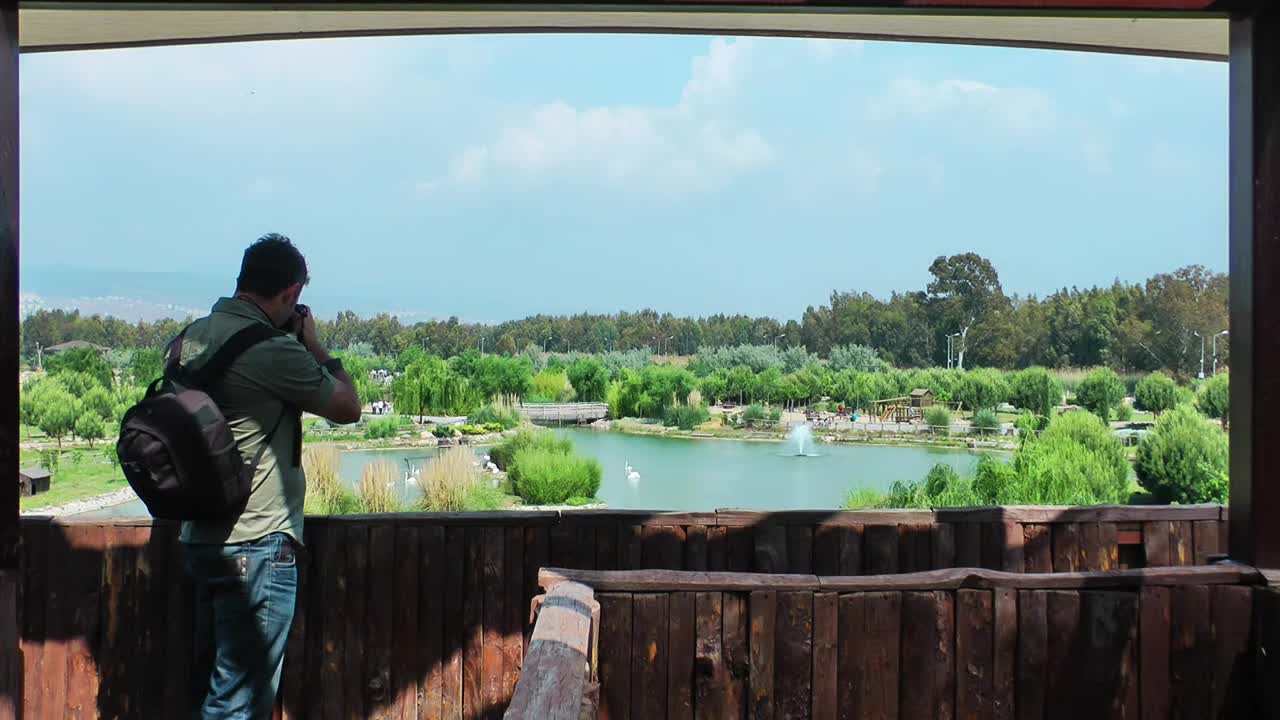   Stock Footage Videographer Panning Out Of A Lake Live Wallpaper