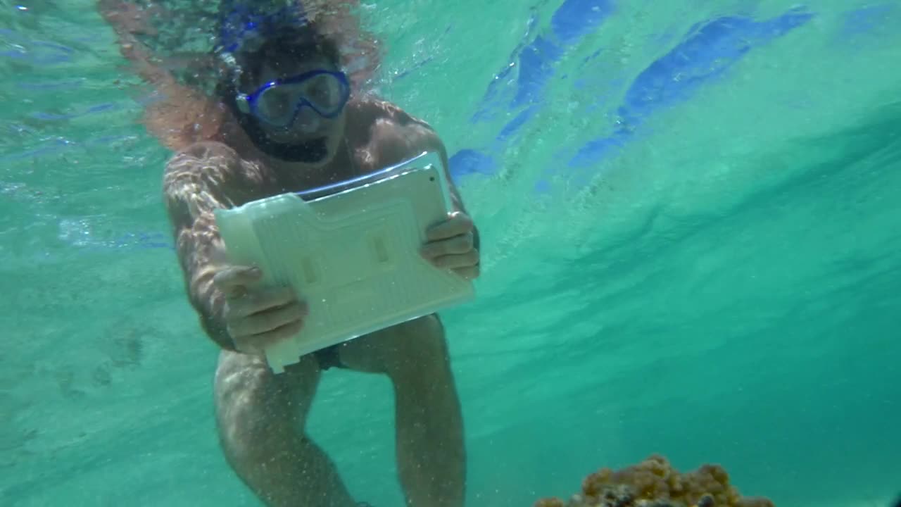   Stock Footage Using A Tablet Underwater Live Wallpaper