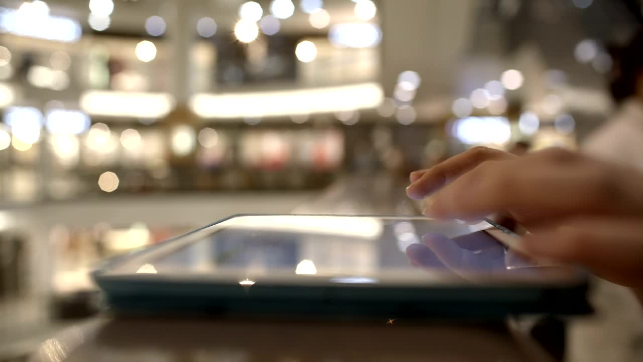  Stock Footage Using A Tablet In A Mall Live Wallpaper