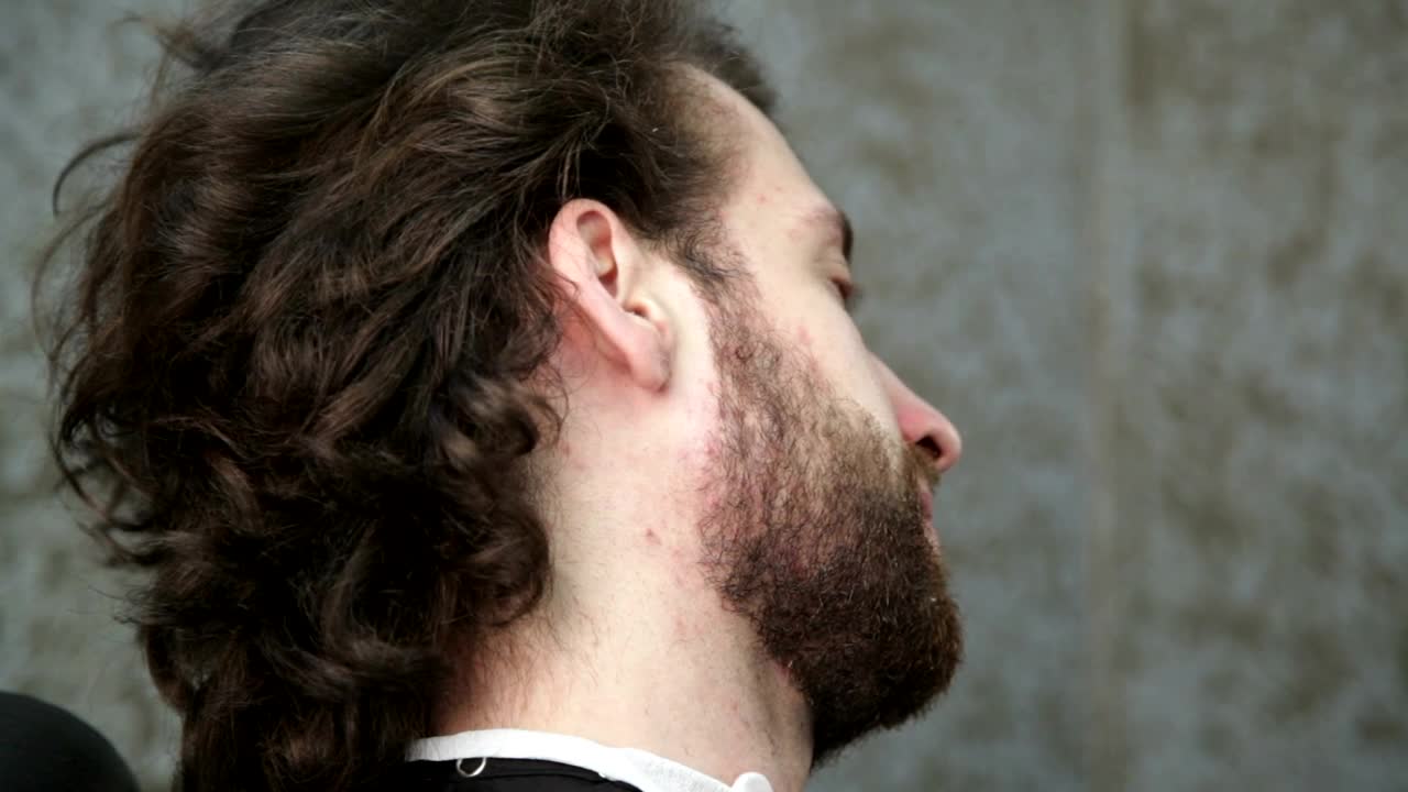   Stock Footage Using A Straight Razor To Shave A Beard Live Wallpaper