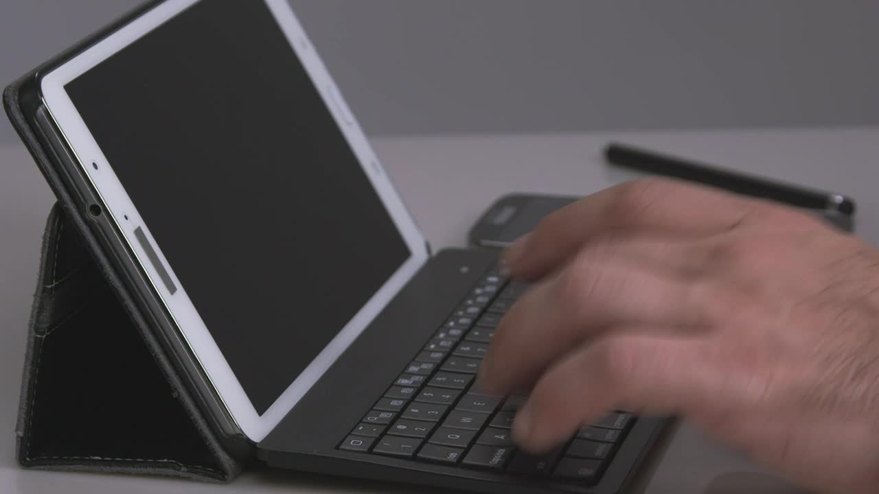   Stock Footage Using A Keyboard With A Tablet Live Wallpaper