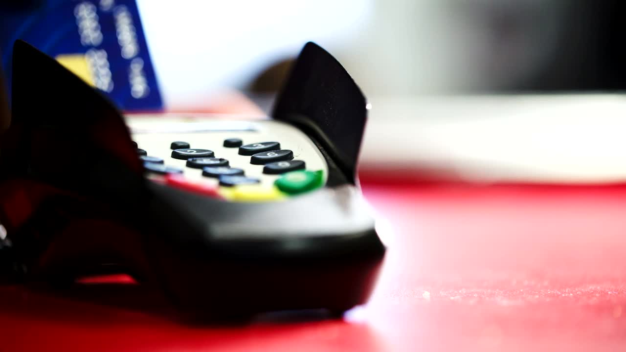   Stock Footage Using A Card Machine At The Counter Live Wallpaper