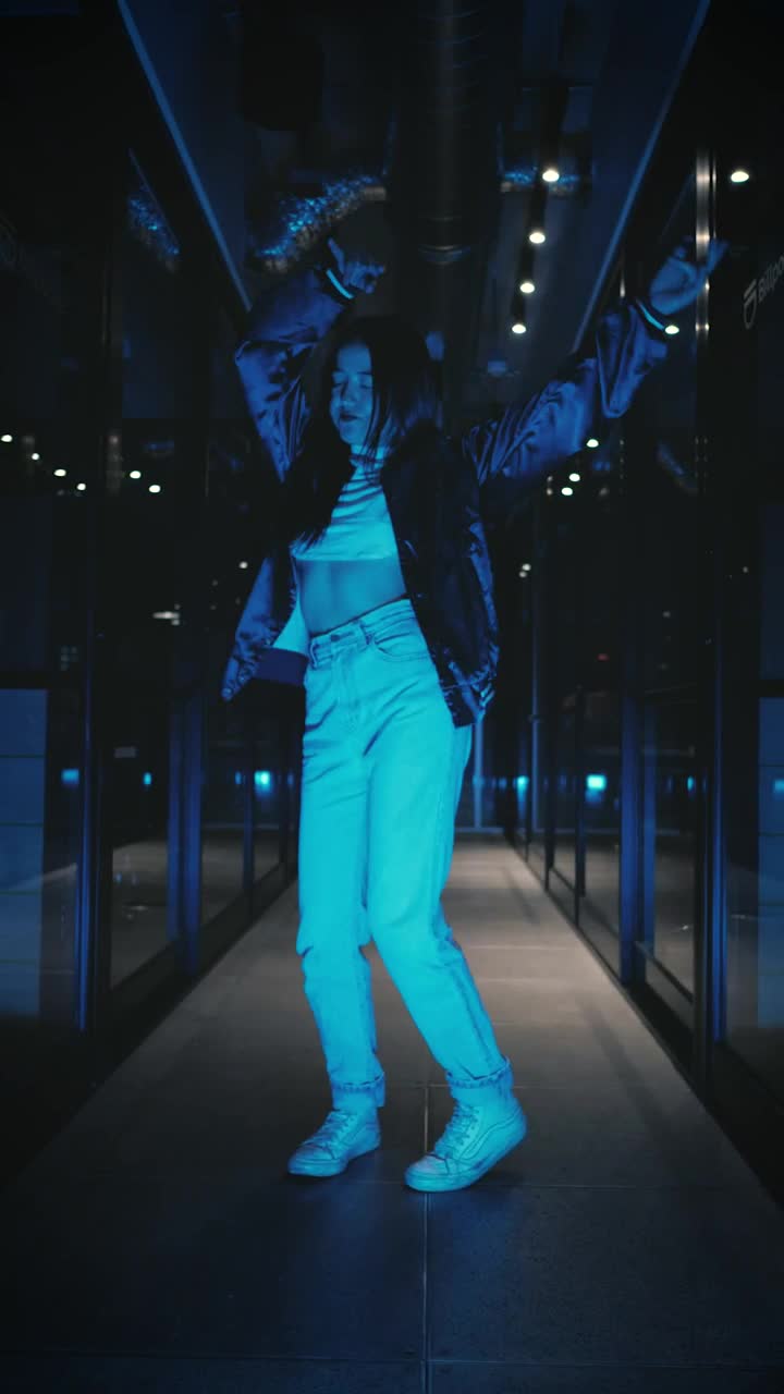   Stock Footage Urban Trendy Woman Dancing In A Dark Corridor Live Wallpaper