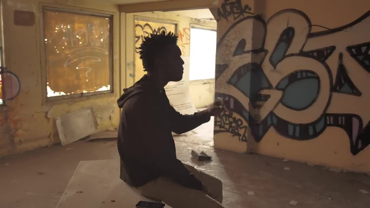   Stock Footage Urban Man Smoking At A Ruined Building Live Wallpaper