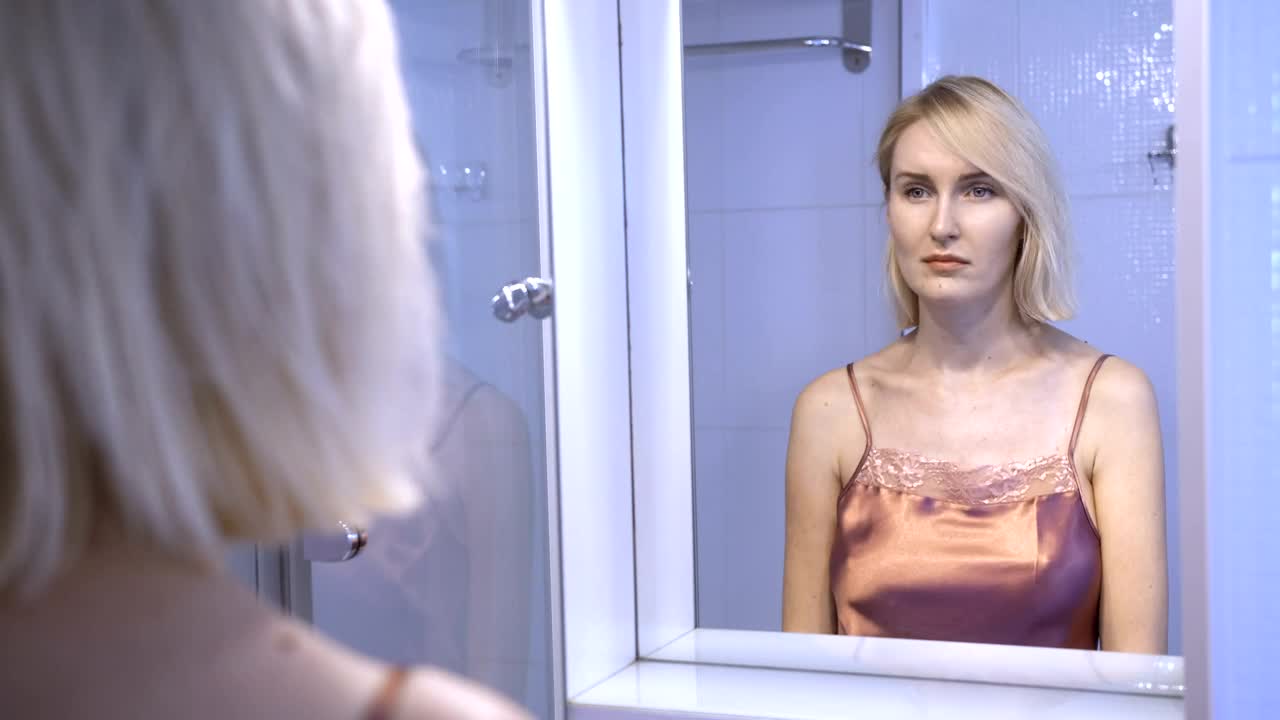   Stock Footage Upset Woman Looking In The Mirror Live Wallpaper