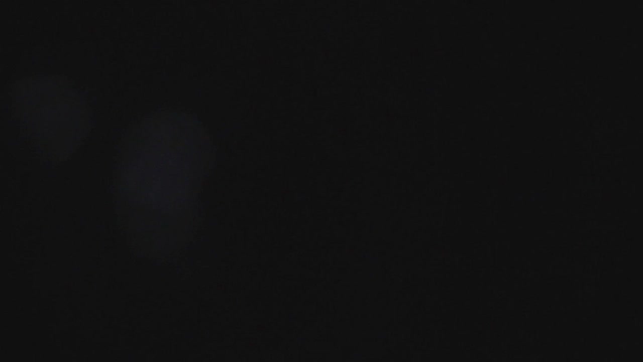   Stock Footage Unfocused Lights In A Black Background Live Wallpaper