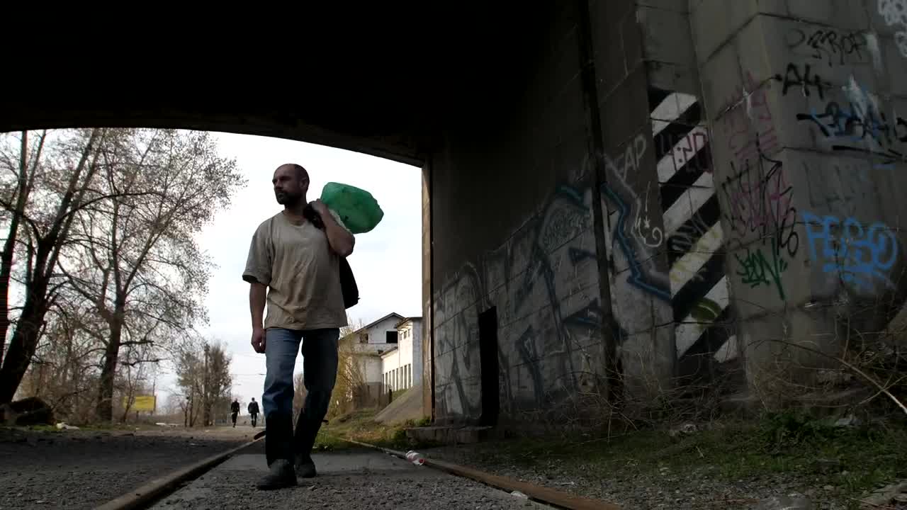   Stock Footage Unemployed Man Walking With A Bag Live Wallpaper