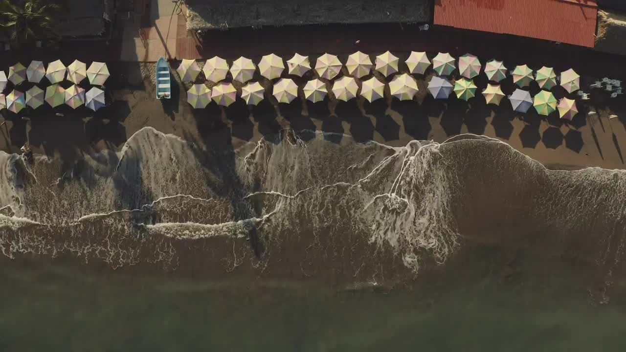   Stock Footage Umbrellas On The Beach In Front Of The Sea Live Wallpaper