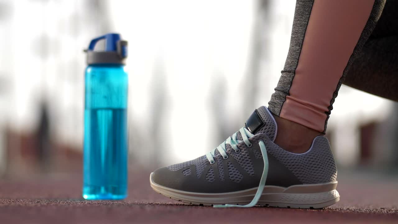   Stock Footage Tying Sneakers Before Running Live Wallpaper