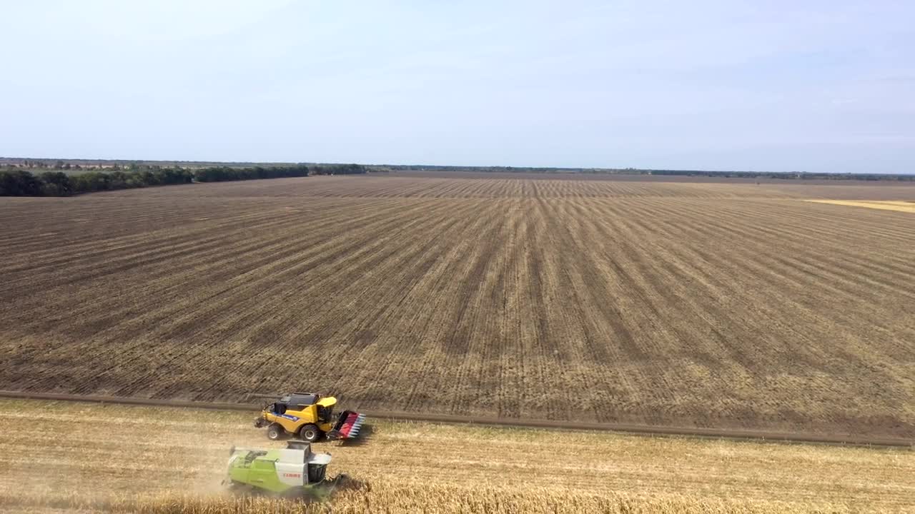   Stock Footage Two Tractors Harvesting Large Crop Fields Live Wallpaper