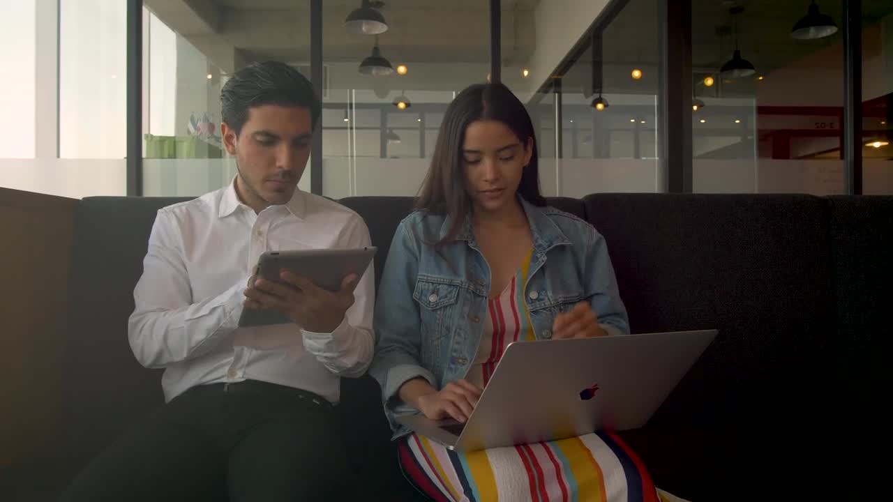   Stock Footage Two People Working On Electronic Devices Live Wallpaper