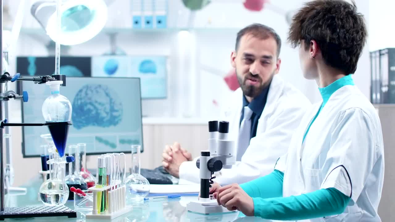   Stock Footage Two Men Working In A Laboratory Live Wallpaper