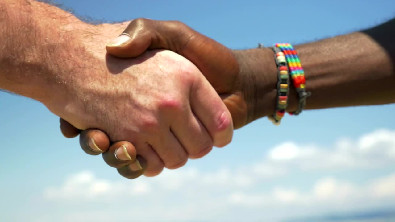   Stock Footage Two Men Shake Hands Outside Live Wallpaper