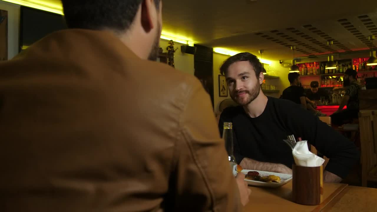   Stock Footage Two Men Chatting In A Restaurant Bar Live Wallpaper