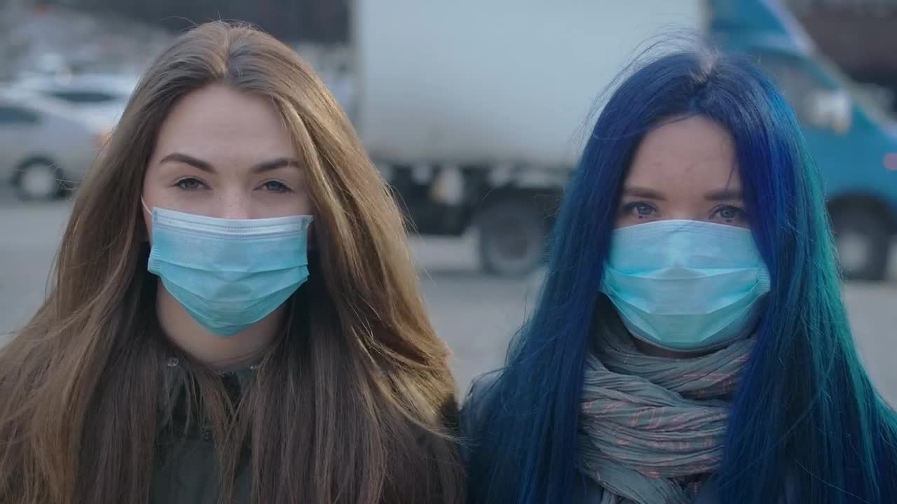   Stock Footage Two Girls With Masks On The Street Live Wallpaper