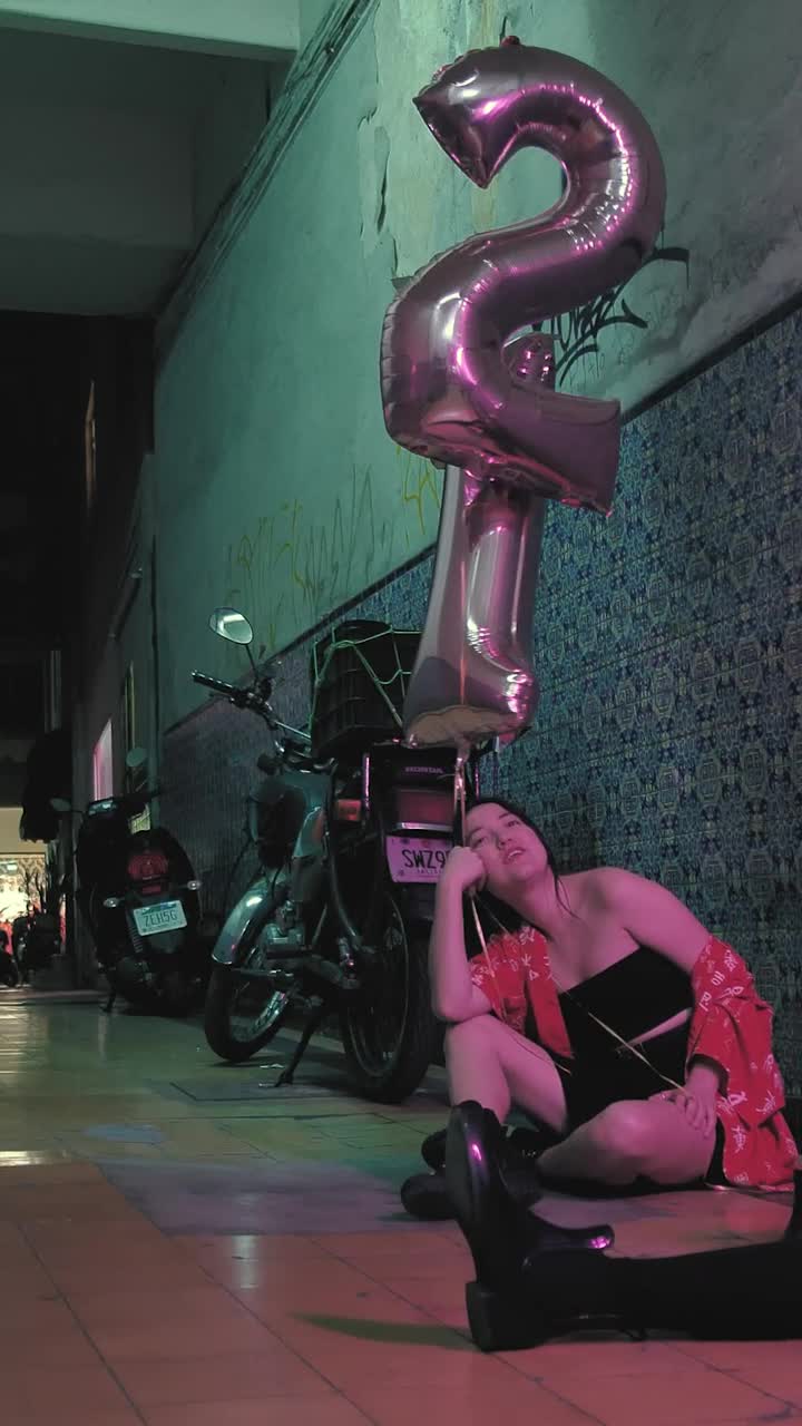   Stock Footage Two Girls With Balloons Sitting While Talking Live Wallpaper