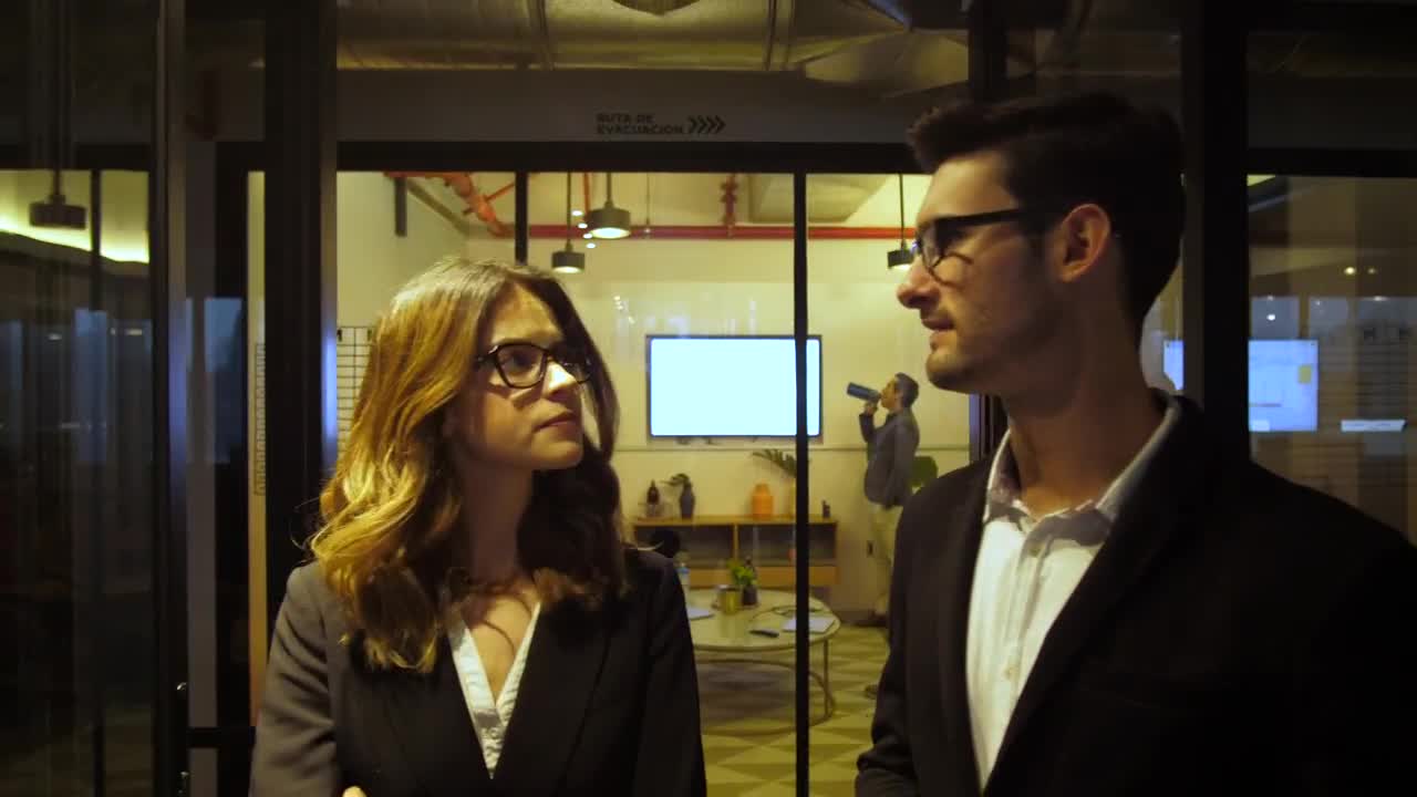   Stock Footage Two Business People Walk In An Office Hall Live Wallpaper