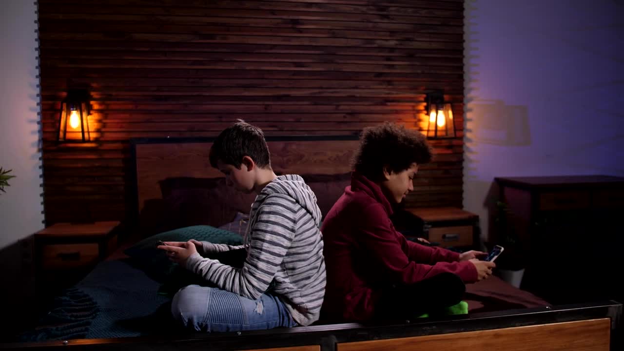   Stock Footage Two Boys Playing With Their Phones Live Wallpaper