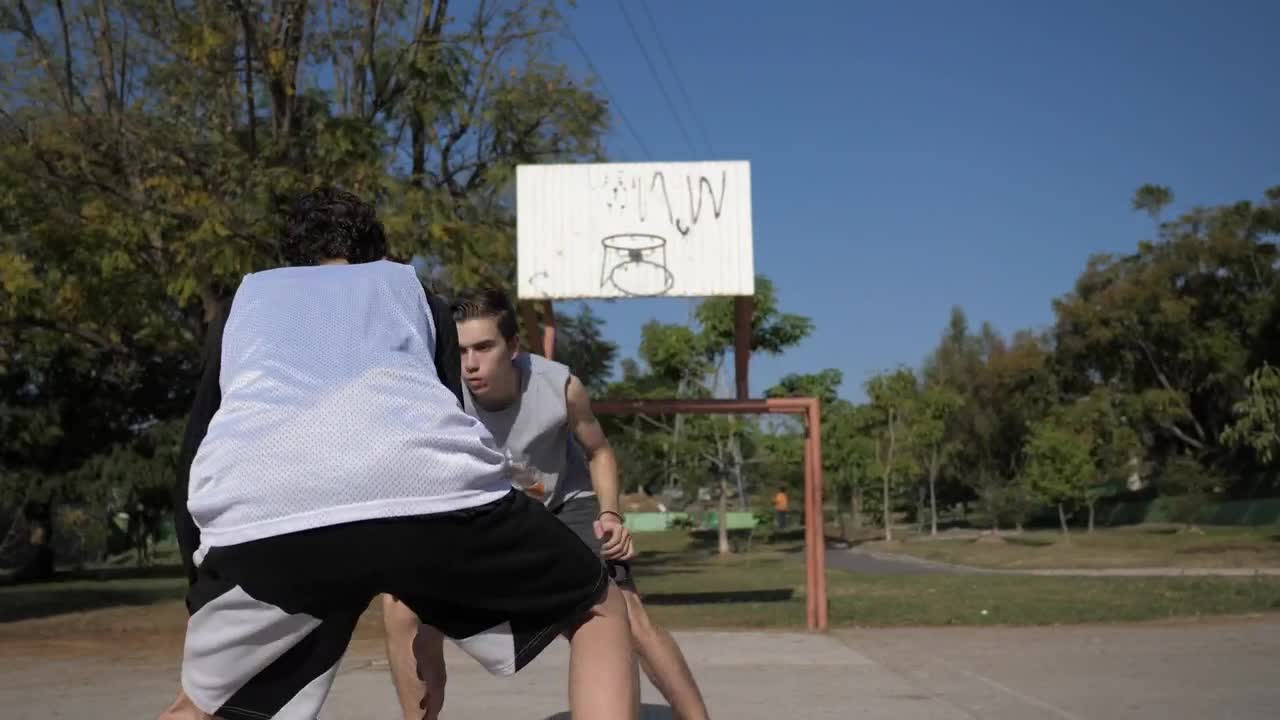   Stock Footage Two Boys Playing Basketball At An Outdoor Court Live Wallpaper