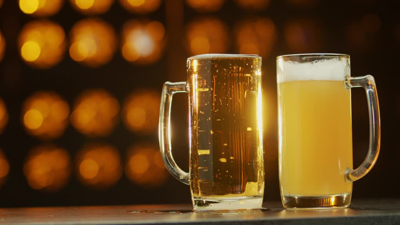   Stock Footage Two Beers Against An Orange Background Live Wallpaper