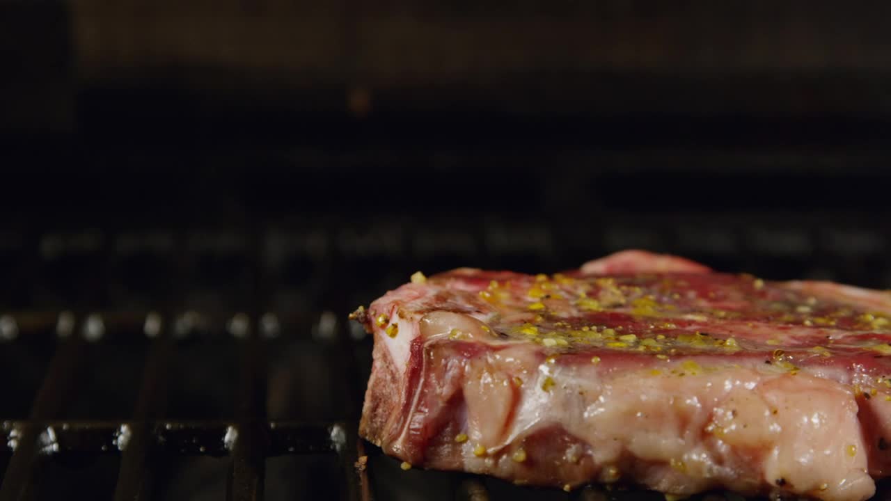   Stock Footage Turning Over A Porterhouse Live Wallpaper