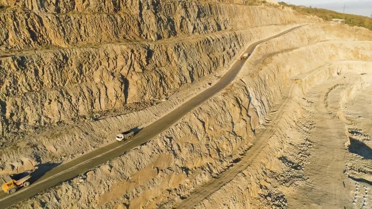   Stock Footage Trucks Driving Along A Quarry Road Live Wallpaper