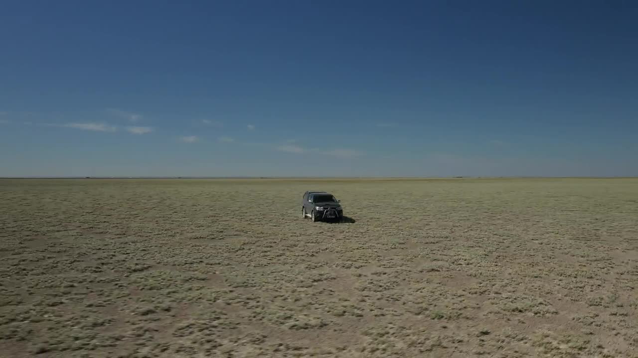   Stock Footage Truck Heading Through Dusty Terrain Live Wallpaper
