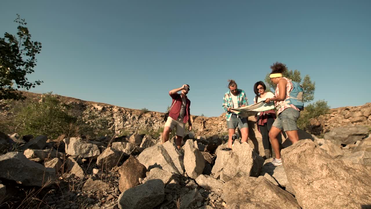   Stock Footage Travellers Checking The Map In The Wilderness Live Wallpaper