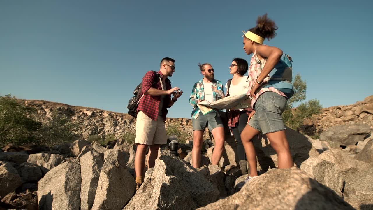   Stock Footage Travelers Looking At Map In The Countryside Live Wallpaper