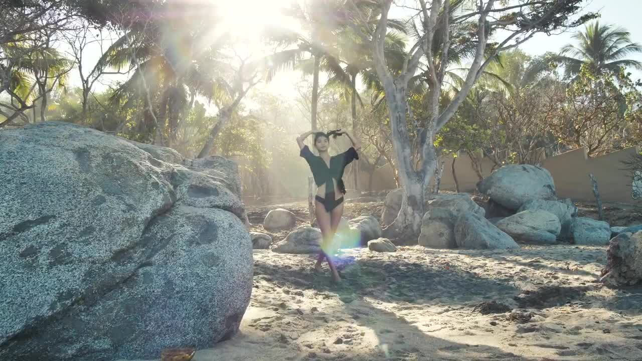 Stock Footage Woman Walking Slowly Through Rocks On A Beach Live Wallpaper Free