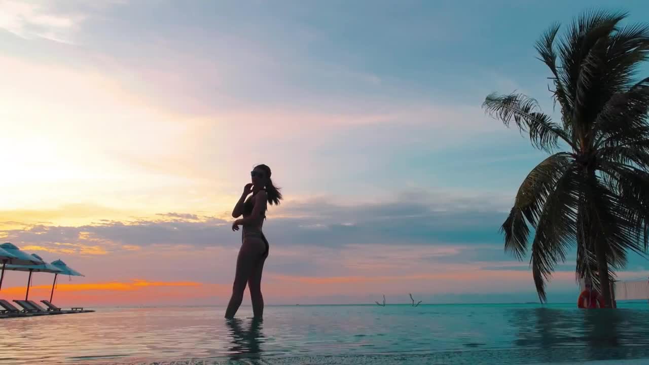 Stock Footage Woman Doing Yoga In A Pool At Sunset Live Wallpaper Free