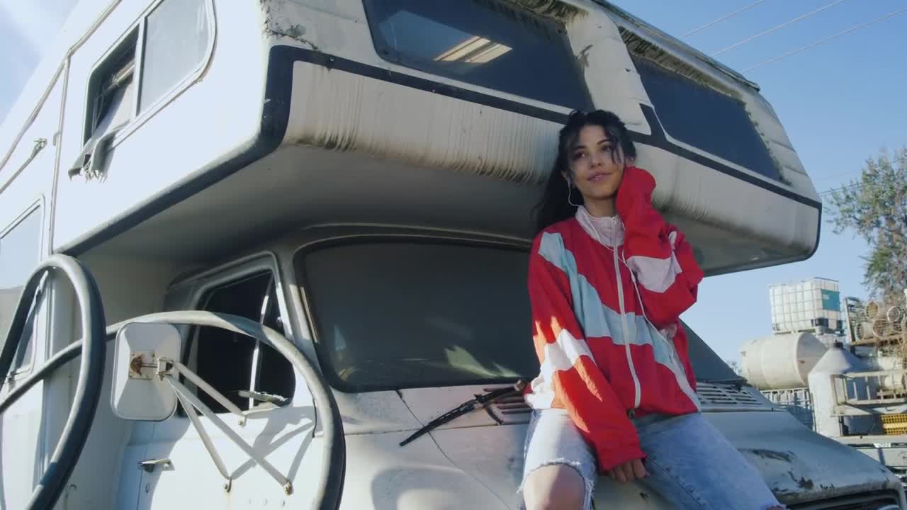 Stock Footage Woman Sitting On Hood Of Motor Home Live Wallpaper Free
