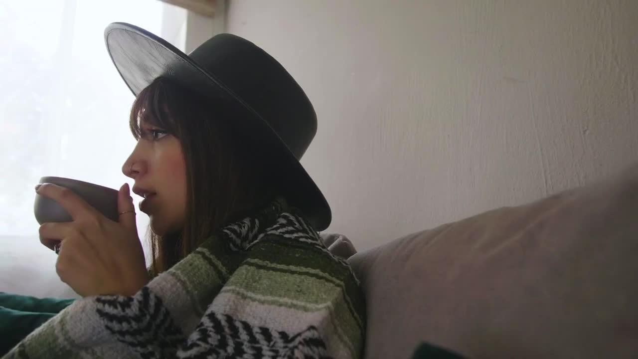 Stock Footage Woman Sipping From A Mug At Home Live Wallpaper Free