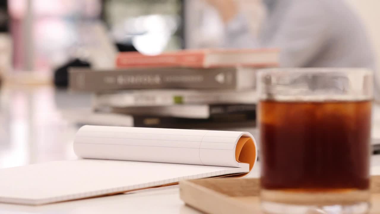 Stock Footage Writing On A Notebook At A Coffee Shop Live Wallpaper Free