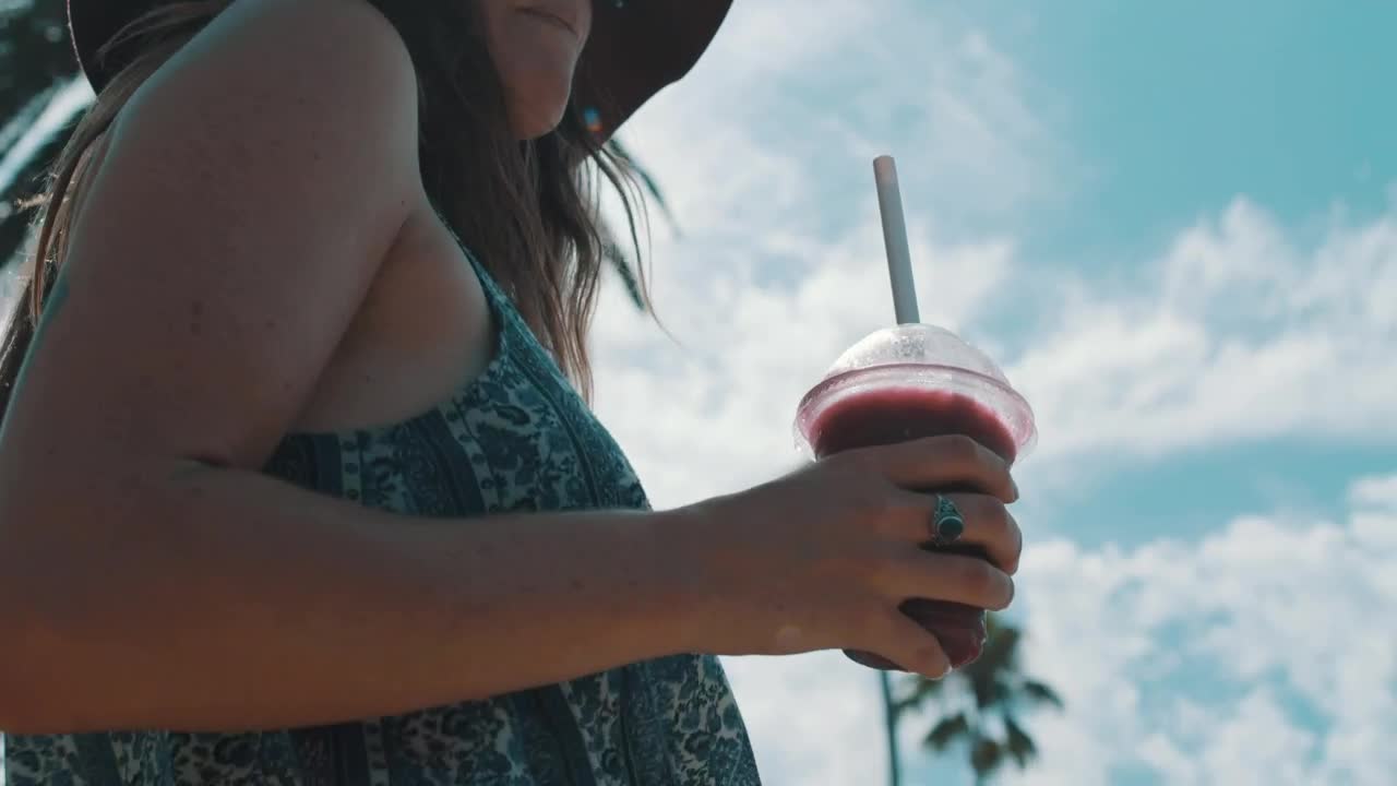 Stock Footage Woman Holds Cold Drink Live Wallpaper Free