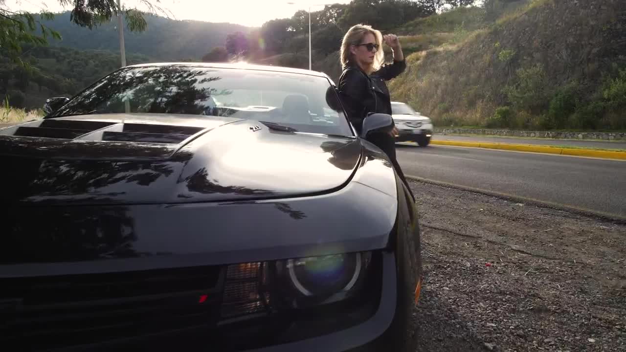 Stock Footage Woman Leaning On A Car Live Wallpaper Free