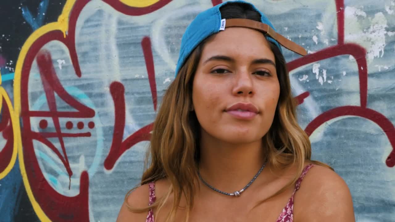 Stock Footage Woman Smiling In Front Of Graffiti Live Wallpaper Free